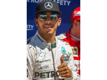 Mercedes driver Lewis Hamilton of Great Britain gives the thumbs up after qualifying with pole position for the F1 Canadian Grand Prix after the qualifying session for the F1 Canadian Grand Prix at Circuit Gilles-Villeneuve in Montreal on Saturday, June 6, 2015.