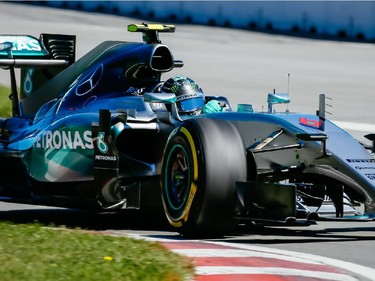 Mercedes Formula 1 driver Nico Rosberg of Germany takes turn three during the third practice session for the F1 Canadian Grand Prix at Circuit Gilles-Villeneuve in Montreal on Saturday, June 6, 2015.