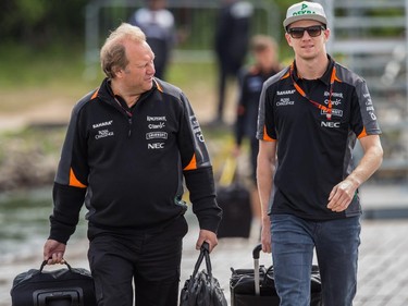 MONTREAL, QUE.: JUNE 7, 2015 -- Force India Formula 1 driver Nico Hulkenberg of Germany, right, arrives at the Circuit Gilles-Villeneuve for the 2015 Canadian Grand Prix in Montreal on Sunday, June 7, 2015. (Dario Ayala / Montreal Gazette)
