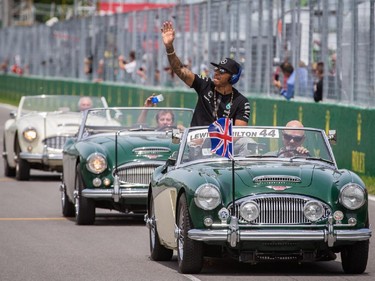 MONTREAL, QUE.: JUNE 7, 2015 -- Mercedes Formula 1 driver Lewis Hamilton of Great Britain waves to fans during the driver's parade before the start of the F1 Canadian Grand Prix at Circuit Gilles-Villeneuve in Montreal on Sunday, June 7, 2015. (Dario Ayala / Montreal Gazette)