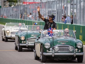 Mercedes driver Lewis Hamilton of Great Britain waves to fans during the drivers' parade before the start of the Canadian Grand Prix at Circuit Gilles Villeneuve in Montreal on June 7, 2015.
