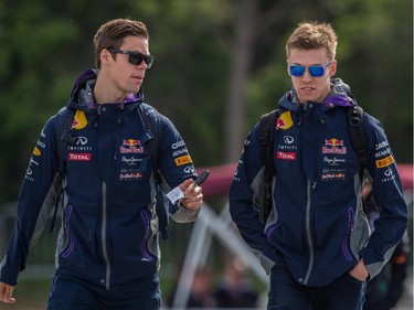 MONTREAL, QUE.: JUNE 7, 2015 --  Red Bull Formula 1 driver Daniil Kvyat of Russia, right, arrives at the Circuit Gilles-Villeneuve for the 2015 Canadian Grand Prix in Montreal on Sunday, June 7, 2015. (Dario Ayala / Montreal Gazette)