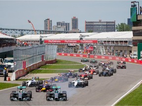 Formula One cars take the first turn at the start of the Canadian Grand Prix on Circuit Gilles Villeneuve on June 8, 2014.