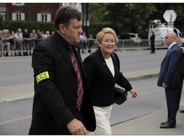 Former Quebec Premier Pauline Marois arrives with a police escort at the Saint-Germain d'Outremont Church, Tuesday June 9, 2015 for the funeral of Jacques Parizeau, also a former Quebec premier.
