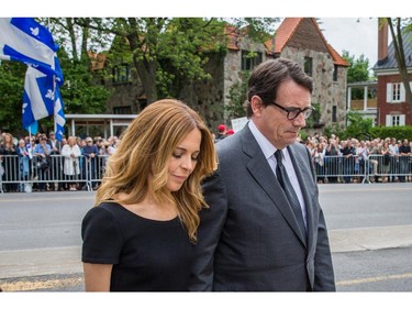 Parti Québécois leader Pierre-Karl Peladeau, right, and wife Julie Snyder, left, arrive for the funeral for former Quebec premier Jacques Parizeau at Saint-Germain d'Outremont Church in Montreal on Tuesday, June 9, 2015.