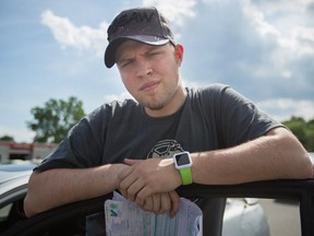 Jeffrey Macesin, who was recently given a $120 ticket for using his Apple Watch while driving, poses for a photograph in Pincourt, west of Montreal on Saturday, May 30, 2015.