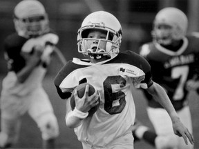 Alexander Park Cardinals Liam Mahoney runs with the ball during North Shore Football League game against A Ma Baie during the 1998 football season.