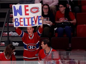 A young fans flashes a sign in support of the Montreal Canadiens during the pre game warmup skate before facing the Tampa Bay Lightning May 9, 2015.