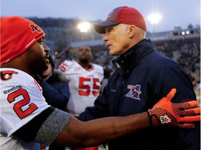 MONTREAL, QUE.: NOVEMBER 16, 2014-- Montreal Alouettes head coach Tom Higgins, right, is congratulated by BC Lions quarterback Kevin Glenn during CFL semifinal action at Molson Stadium  in Montreal on Sunday November 16, 2014.  (Allen McInnis / MONTREAL GAZETTE)