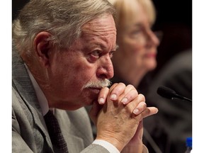 Former Quebec Premier Jacques Parizeau,  representing the Medac, listens to questions during his presentation at the AMF's public hearing into the merits of the takeover of the Toronto Stock Exchange by the bank-owned Maple Group in Montreal on Friday November 25, 2011.