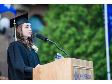 Honours Science graduate Anna Iankovitch, 19, gives the address to the graduating class at convocation ceremonies held outdoors in front of the  Hertzberg Building, in Ste. Anne-de-Bellevue, Quebec on June 11, 2015. Winner of the Schulich Leader Scholarship with a 92.6 grade average, she inspired the audience with a lively speech, saying, "Remember that we, Islanders, come from a small family of Big dreamers!" Established in 1971, some  2,000 students graduated, with 425 diplomas and honours certificates being awarded.