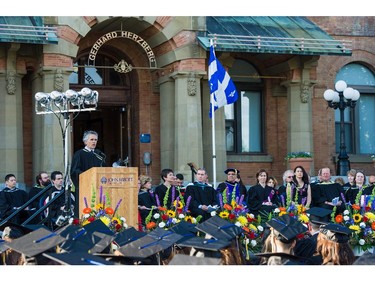 John Halpin, Director General of John Abbott College, addresses the audience at the commencement of convocation ceremonies held outdoors in front of the  Hertzberg Building, in Ste. Anne-de-Bellevue, Quebec on June 11, 2015. Established in 1971, some  2,000 students graduated, with 425 diplomas and honours certificates being awarded.