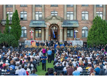 Parents, guests and invitees watch as graduates receive their diplomas, at evening convocation ceremonies held outdoors in front of the Hertzberg Building at John Abbott College in Ste. Anne-de-Bellevue, Quebec on June 11, 2015. Established in 1971, some  2,000 students graduated, with 425 diplomas and honours certificates being awarded.
