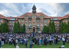 Parents, guests, and invitees watch as graduates receive their diplomas, at evening convocation ceremonies held outdoors in front of the Hertzberg Building at John Abbott College in Ste. Anne-de-Bellevue, Quebec on June 11, 2015. Established in 1971, some  2,000 students graduated, with 425 diplomas and honours certificates being awarded.