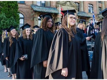 Students file out of the Hertzberg Building for commencement of the convocation ceremonies held outdoors at John Abbott College in Ste. Anne-de-Bellevue, Quebec on June 11, 2015. Established in 1971, some  2,000 students graduated, with 425 diplomas and honours certificates being awarded.