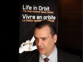 Industry Minister James Moore talks to reporters after he announced Canada's commitment to fly two Canadian astronauts to space by 2024 during a news conference in Ottawa, Tuesday June 2, 2015.THE CANADIAN PRESS/Fred Chartrand