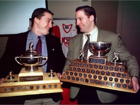 Brothers J.P. (left) and Mathieu Darche hold their McGill Most Valuable Player trophies at awards banquet on April 4, 1998.  J.P. won his award for football;  Mathieu for hockey.