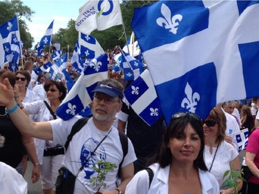 Participants march in the annual Fête nationale parade on St-Denis St. in Montreal on June 24, 2015.