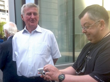 Former Montreal mayor Pierre Bourque, left, at the visitation for Jacques Parizeau on June 6, 2015.