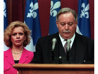 Quebec Pemier Jacques Parizeau looks down as he announces his resignation to be effective at the end of the fall session, Oct. 31, 1995. His wife Lisette Lapointe looks on. Former Quebec premier Jacques Parizeau has died at the age of 84.