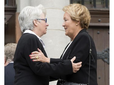 Former Quebec premier Pauline Marois, right, arrives for funeral services for former Quebec premier Jacques Parizeau Tuesday, June 9, 2015 in Montreal.
