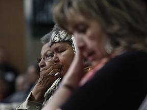 People express their emotions during the Truth and Reconciliation Commission of Canada's regional event at the Victoria Conference Centre in Victoria, April 13, 2012.