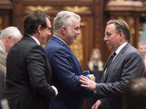 Philippe Couillard, centre, with François Legault and Pierre-Karl Peladeau: at election time, the Parti Québécois and Coalition Avenir Québec will each sell themselves as the credible alternative to the Liberals.