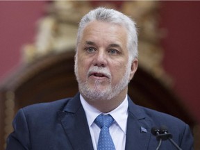Quebec Premier Philippe Couillard speaks during a swearing in ceremony for two new members, Wednesday, June 17, 2015 at the legislature in Quebec City.
