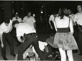 Police raid the Sex Garage party in Montreal, July 15, 1990. "If it wasn't for Linda Dawn Hammond's photos of my party and the police raid," said organizer Nicolas Jenkins, "there would be no photographic evidence of police violence that night. It would have been our word against theirs."  (Linda Dawn Hammond / Special to Montreal Gazette)
