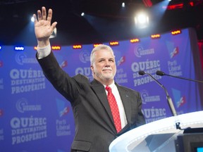 Quebec Premier Philippe Couillard waves to the crowd at the Quebec Liberal Party convention in Montreal.