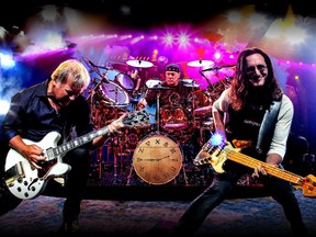 "It does give one pause to soak in everything we’ve done over the last 40 years,” says Geddy Lee, right, with Rush bandmates Alex Lifeson, left, and Neil Peart. “But I still feel like we’ve got some mojo." Rush's 40th-anniversary tour stops at Montreal's Bell Centre on June 21.