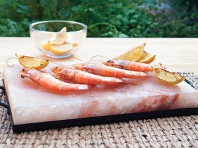 Pink Himalayan salt blocks, carved from sea salt deposits near the famous mountain range, are preheated for 30 minutes in the barbecue or oven to impart natural seasoning and tenderness to food cooked on them.