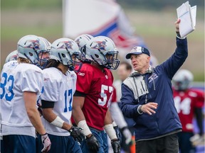 Montreal Alouettes head coach Tom Higgins, right, will lead the team through 60 offensive/defensive plays during its scrimmage on Sunday.
