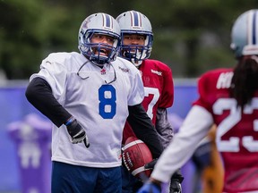 SHERBROOKE, QUE.: MAY 31, 2015 -- Nik Lewis, left, takes part in the Montreal Alouettes training camp at Bishop's University in Lennoxville, Quebec on Sunday, May 31, 2015. (Dario Ayala / Montreal Gazette)