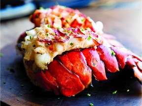 Slather hot grilled lobster with garlic butter in this traditional recipe from a new lobster cookbook.