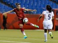 Vicky Losada #14 of Spain kicks the ball near Diana Saenz #5 of Costa Rica during the 2015 FIFA Women's World Cup Group E match at Olympic Stadium on June 9, 2015 in Montreal.
