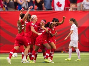 The Canadian team celebrates at the final whistle after defeating Switzerland 1-0 in the FIFA Women's World Cup.