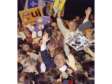 Quebec Premier Jacques Parizeau makes his way through crowd of supporters at the Verdun  Auditorium October 25, 1995.