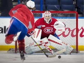 Canadiens forward P.A. Parenteau takes a shot against goalie Carey Price during practice at Amalie Arena in Tampa, Fla., on May 12, 2015.