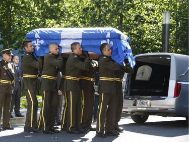 The casket of former Quebec premier Jacques Parizeau arrives before lying in state at Caisse de dépôt et placement du Québec in Montreal on Saturday, June 6, 2015.
