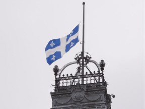 The Quebec flag flies at half-mast on the high tower of the National Assembly, in honour of former premier Jacques Parizeau.