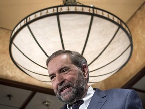 NDP leader Thomas Mulcair walks off the stage after delivering a luncheon speech Thursday, June 11, 2015 in Montreal.