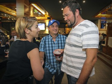Musi-Cafe owner Yannick Gagne, right, with waitress Annie Larochelle and her fiance Daniel Guay in Lac-Mgantic, Thursday July 02, 2015.  Gagne will officiate the wedding of Larochelle and Guay in Musi-Cafe in April 2016.