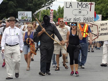 Protesters take to the streets of Lac-Megantic, 250 kilometres east of Montreal Saturday July 04, 2015 to voice their opposition to the transport of oil by rail through their community.  The demonstration took place two days before the anniversary of the 2013 train derailment that levelled the centre of the town and killed 47 residents.