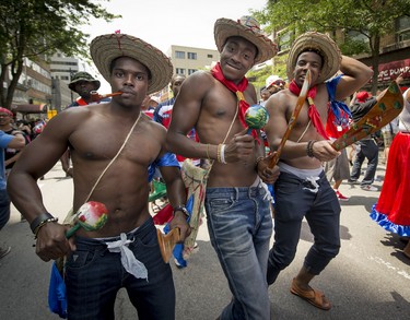 MONTREAL, QUE.: JULY 4, 2015 --  Members of the Haitian community dance down rue Ste. Catherine during the 40th Carifiesta parade in Montreal, on Saturday, July 4, 2015. (Peter McCabe / MONTREAL GAZETTE)