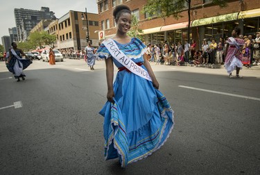 MONTREAL, QUE.: JULY 4, 2015 --  Representing Port Au Prince, A young girl marches down down rue Ste. Catherine during the 40th Carifiesta parade in Montreal, on Saturday, July 4, 2015. (Peter McCabe / MONTREAL GAZETTE)