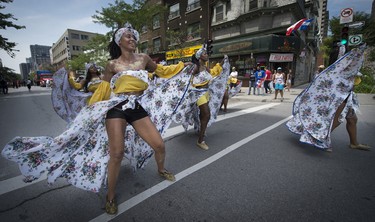 MONTREAL, QUE.: JULY 4, 2015 --  Members of Caribbean community dances down rue Ste. Catherine during the 40th Carifiesta parade in Montreal, on Saturday, July 4, 2015. (Peter McCabe / MONTREAL GAZETTE)