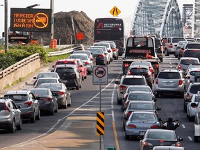 MONTREAL, QUE.: JULY 3, 2015-- Two cars jump lanes as they line up to board the south bound Mercier Bridge in Montreal on Friday July 3, 2015. Construction has reduced the bridge to one lane in each direction causing long delays. (Allen McInnis / MONTREAL GAZETTE)
