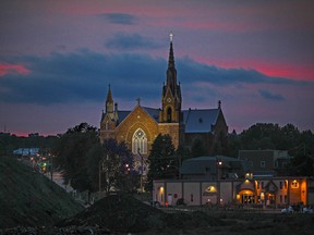 The sun sets behind Paroisse Ste-Agnes in Lac-Megantic, 250 kilometres east of Montreal Sunday July 05, 2015 on the eve of the 2nd anniversary of the 2013 train derailment and explosion that levelled the centre of the town, killing 47 people.