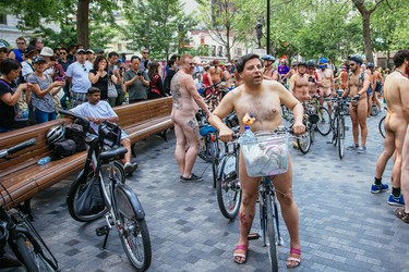 MONTREAL, QUE.: JULY 5, 2015 -- People take part in the Montreal World Naked Bike Ride at Dorchester Square in downtown Montreal on Sunday, July 5, 2015. The World Naked Bike Ride event aims to encourage cycling, promote environmentalism, and address body image issues. (Dario Ayala / Montreal Gazette)